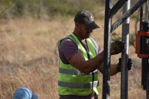 Dylan Robinson, Director at Tau Africa, on site managing a core drilling rig