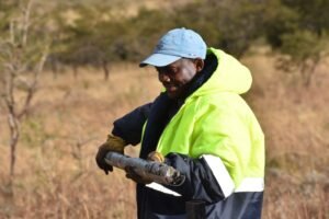 Sipho Shirlyboy Mtsweni, Core Driller and Operator at Tau Africa, working with drill rods on site