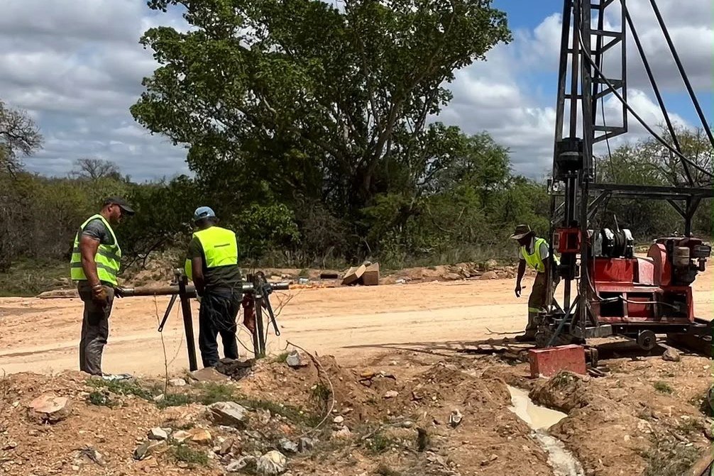 Tau Africa crew and drilling rig on site for the D3221 bridge river crossing, Limpopo